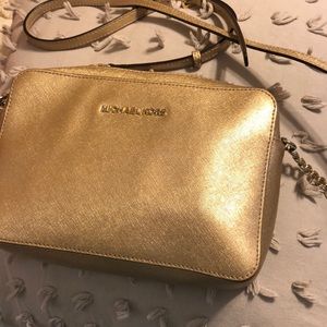 Shiny gold Michael Kors crossbody
